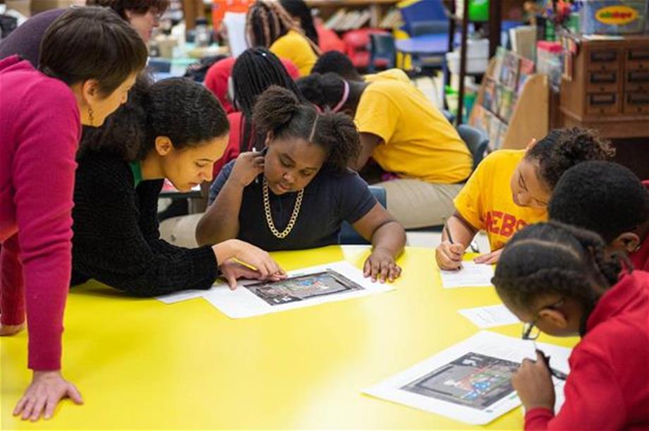 Students and teachers at Webster Elementary School in the Lawndale neighborhood review plans for a new schoolyard funded through the Space to Grow initiative. (Courtesy Metropolitan Water Reclamation District of Greater Chicago)
